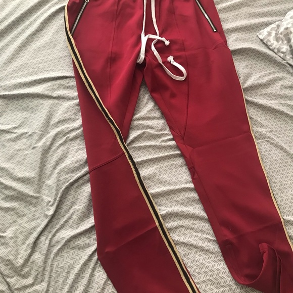 Men’s red striped jogger track pants. Elastic waistband with draw cord. - Picture 2 of 7